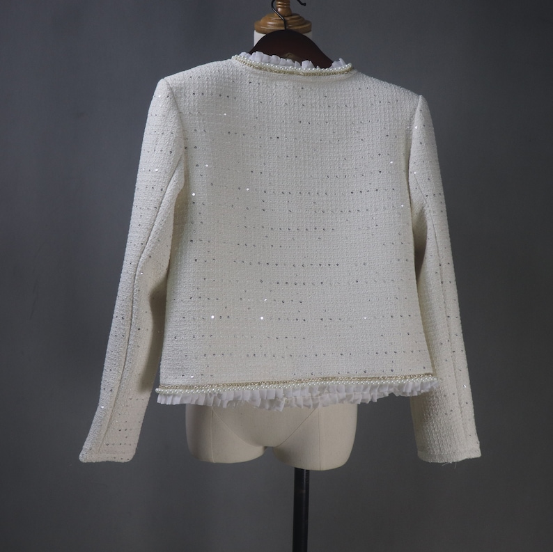 Back view of custom white sequin jacket with pearl and chain trim – elegant women’s formal jacket for weddings, graduations, and evening events