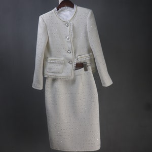 Front view of custom-made white sequin jacket and skirt set with pearl and chain trim – elegant women's formal suit for wedding, graduation, or evening dinner