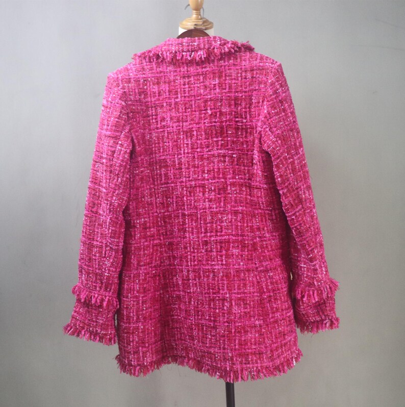 Back view of the handmade hot pink tweed blazer highlighting its structured fit, clean seam lines, and raw-edge fringe hem.