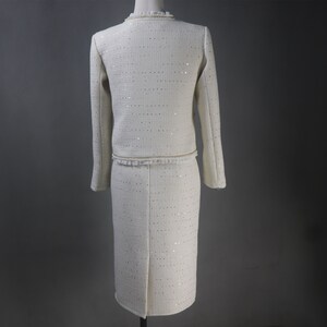 Back view of custom white formal suit with sequinned jacket and skirt, featuring pearl and chain trim – handmade outfit for weddings, graduations, or formal events