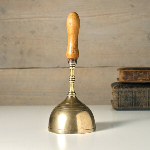 Vintage brass hand bell. Old school bell. Service, metal dinner bell. Wooden handle. Antique bell. Man cave.