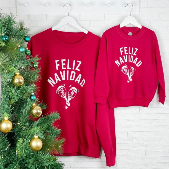 Buy Feliz Navidad Matching Family Christmas Jumper Set. Online in