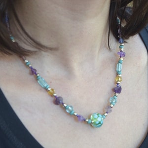 Necklace with glass beading and natural amethyst.