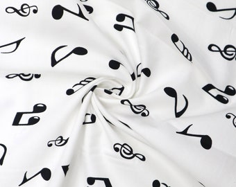 fat quarter of cotton poplin with large white musical notes on black 