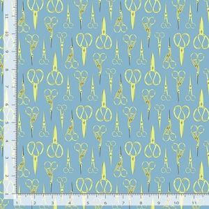 May include: A light blue fabric with a repeating pattern of yellow scissors in various styles. The scissors are arranged in a random, all-over design. The fabric is suitable for sewing and crafting projects.