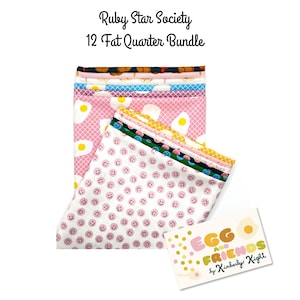 May include: A bundle of 12 fat quarters from Ruby Star Society. The fabrics feature various patterns, including fried eggs, smiley faces, and colorful designs. A card with the text "Egg and Friends by Kimberly Kight" is also included.