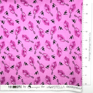 May include: Pink fabric with a repeating pattern of pink lipstick-shaped objects and black squiggles. The fabric has the text "MIX TAPE by parnmiejane for dearSTELLA DEARSTELLA" printed along the bottom edge. Flamingo Mosingo Fabric Co. is printed on the right edge.