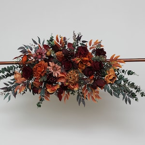 Rust burgundy cinnamon orange flowers Boho arch flowers Floral arch arrangement Fall wedding Boho wedding Wedding corner swag Faux flowers