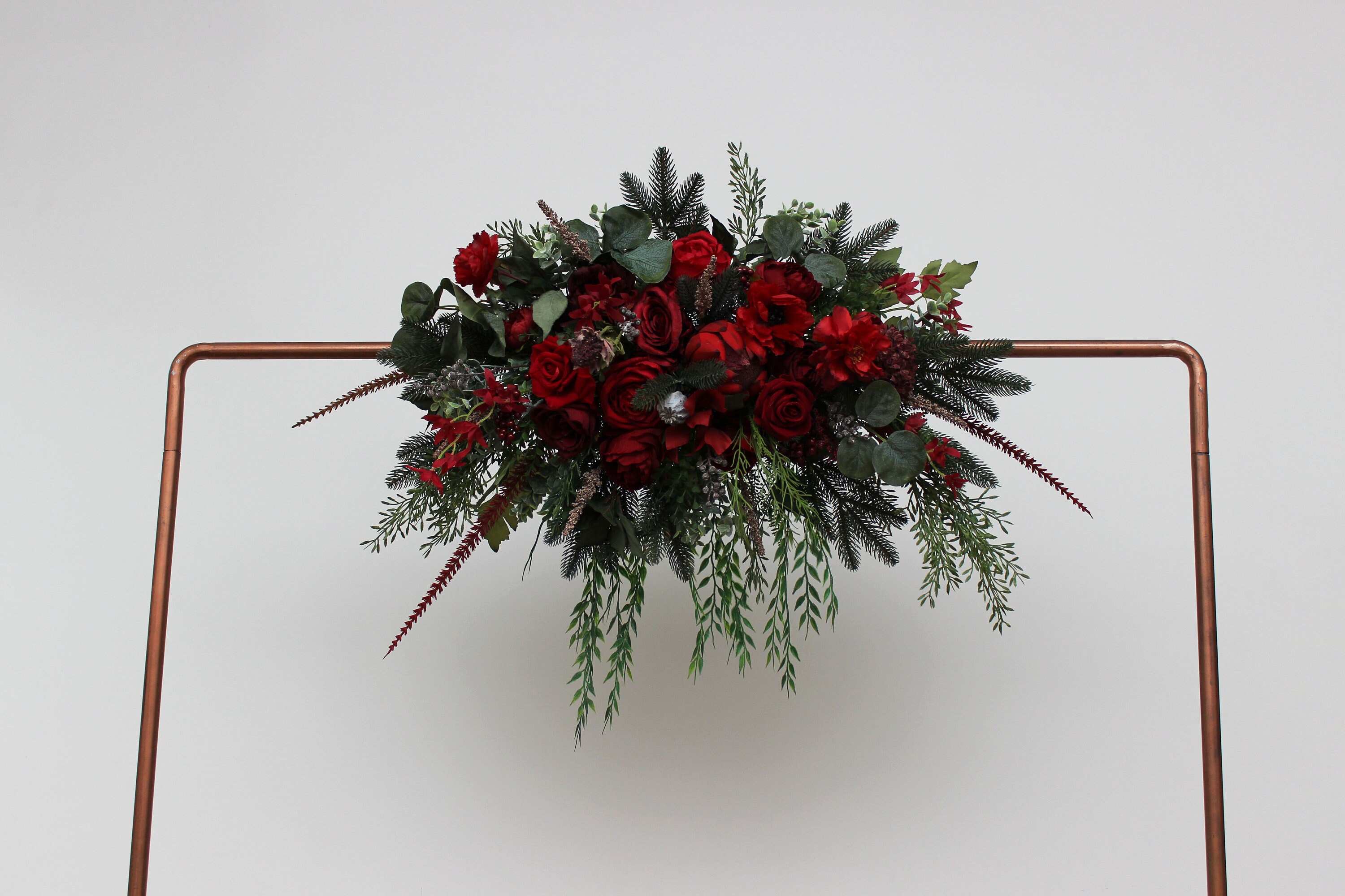 Winter pine arch flowers Red protea arrangement Faux cones  Winter wedding Vine silk flowers Boho wedding Hunter green