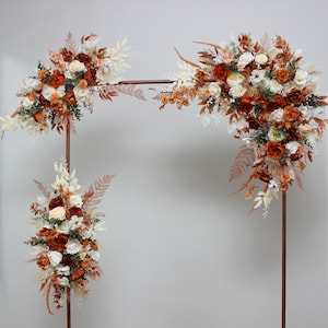 Boho wedding Burnt orange ivory flowers Archway flowers Pergola flowers Wedding arch arrangement