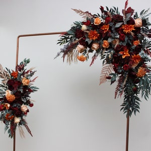 Burnt orange red protea wedding flowers  Archway flowers Pergola flowers Wedding arch arrangement