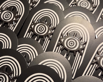 呪われた目のエナメルピン