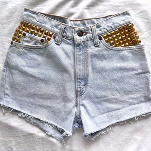 Vintage Levi’s Strauss 512 studded cut off shorts size 28” waist medium M / light wash cotton denim high waisted rise gold pyramid studs