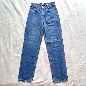 Vintage 1990s Levi Strauss 550 Relaxed Fit Student jeans size 28x32 / high waisted rise medium wash straight tapered leg unisex mens womens