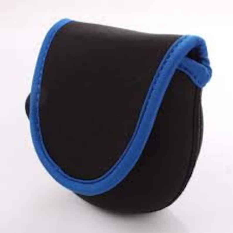 May include: Black fishing reel case with a blue trim. The case is made of a soft, flexible material.