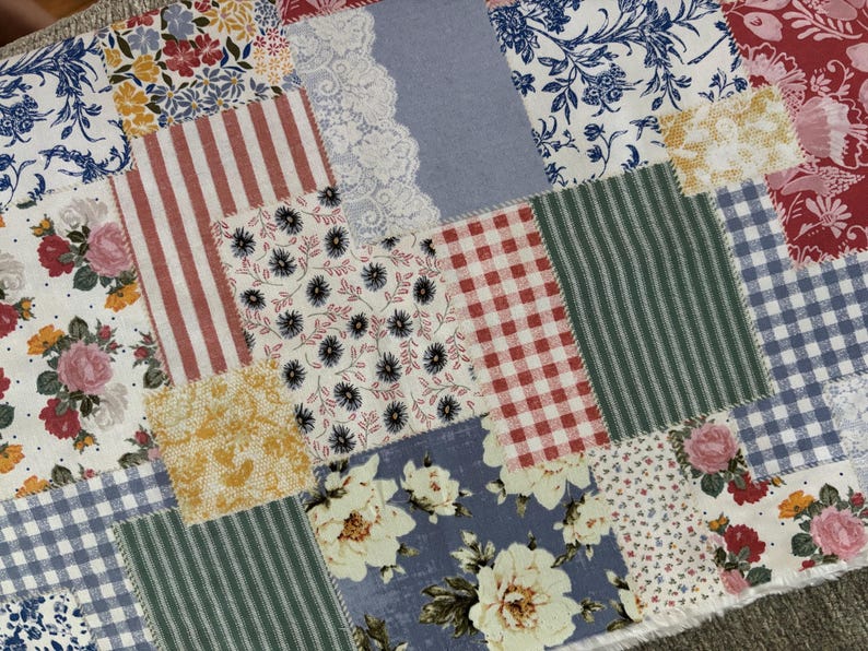 A photo of the patchwork printed fabric. Please note that this is a printed fabric to resemble patchwork, not a hand stitched patchwork.