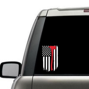 May include: A black and white distressed American flag with a red axe overlayed on the right side. The flag is on a black background.