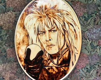 David Bowie as Jereth from Labyrinth handmade wood burned art. With a glossy resin coating for protection.