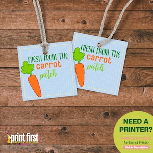 May include: Two blue and white gift tags with a carrot illustration and the text "Fresh from the carrot patch".