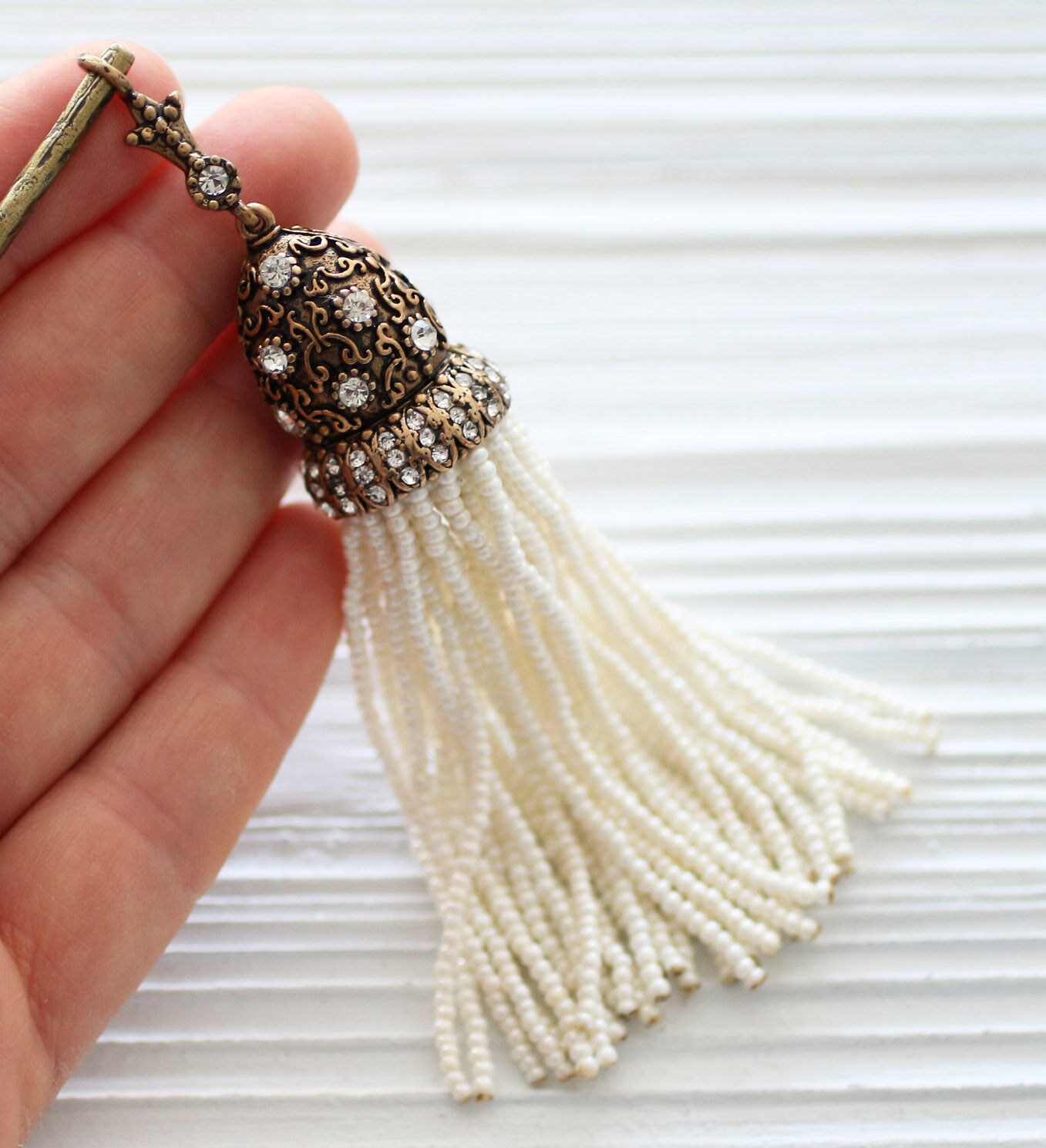 Ivory beaded tassel with clear rhinestones antique cap, ornate bead
