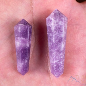 These Lepidolite crystal carved polished double terminated points range in a variety of handheld sizes.  Lepidolite  is mottled light to dark pinkish purple with white splotches.
Crystals are nature-made therefore each one is unique in appearance.