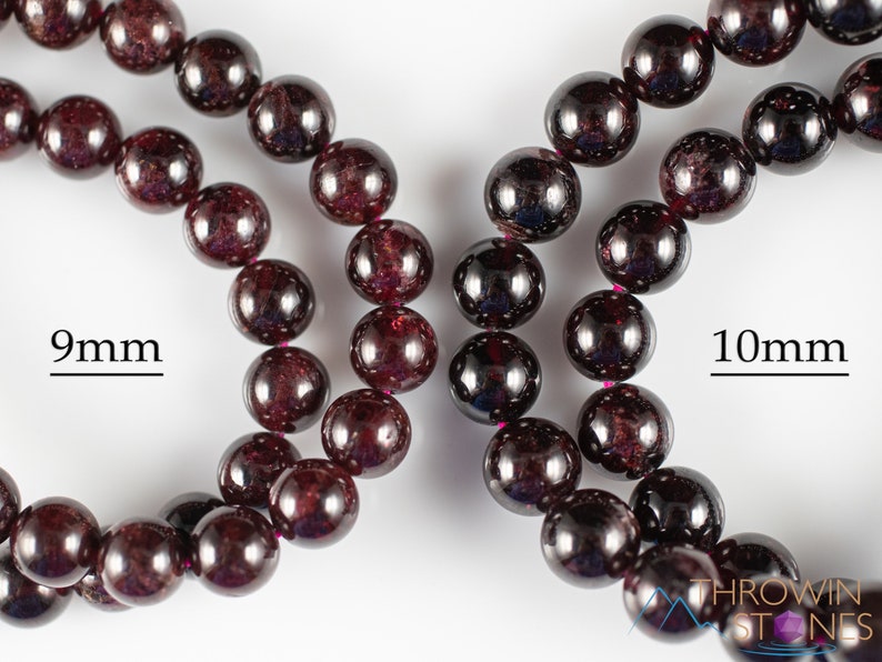 These maroon Garnet crystal bracelets have spherical beads strung on elastic for an endless bracelet.  
Crystals are nature-made therefore each one is unique in appearance.