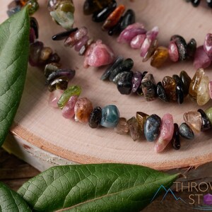 Handcrafted Tourmaline chip bracelet. These rainbow colored tumbled stones are drilled and strung on an elastic cord, to create an endless bracelet. Each crystal bracelet is unique in color, and has a wrist circumference of approximately 6 inches.