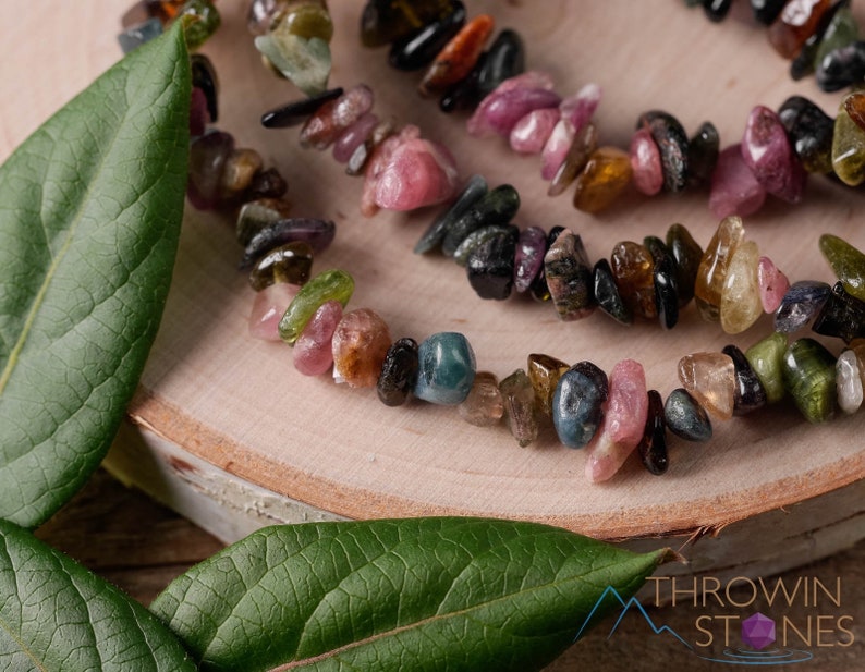 Handcrafted Tourmaline chip bracelet. These rainbow colored tumbled stones are drilled and strung on an elastic cord, to create an endless bracelet. Each crystal bracelet is unique in color, and has a wrist circumference of approximately 6 inches.