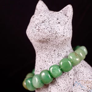 These pale Green Aventurine crystal bracelets have tumbled beads strung on elastic for an endless bracelet.  
Crystals are nature-made therefore each one is unique in appearance.
