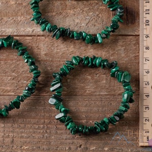 Handcrafted Malachite chip bracelet. These green, tumbled chips, are drilled, and strung on an elastic cord, to create an endless bracelet. Each crystal bracelet is unique in shape, and color, and has a wrist circumference of approximately 6 inches.