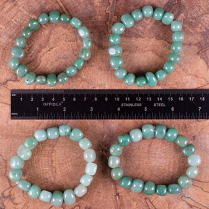 These pale Green Aventurine crystal bracelets have tumbled beads strung on elastic for an endless bracelet.  
Crystals are nature-made therefore each one is unique in appearance.