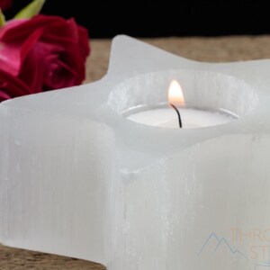 These are white Selenite crystal carved candle holders in the shape of a star.
Crystals are nature-made therefore each one is unique in appearance.