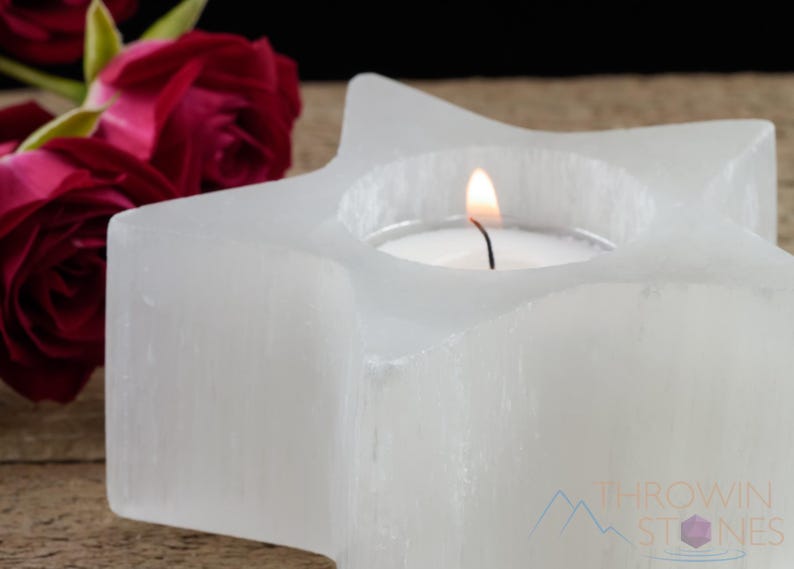 These are white Selenite crystal carved candle holders in the shape of a star.
Crystals are nature-made therefore each one is unique in appearance.