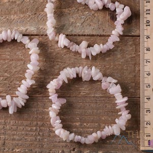 These pale pink Kunzite crystal bracelets have chip beads strung on elastic for an endless bracelet.  
Crystals are nature-made therefore each one is unique in appearance.