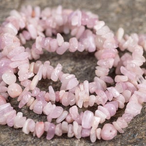 These pale pink Kunzite crystal necklaces have crystal chip beads strung on beading cord for an endless necklace. 
Crystals are nature-made therefore each one is unique in appearance.