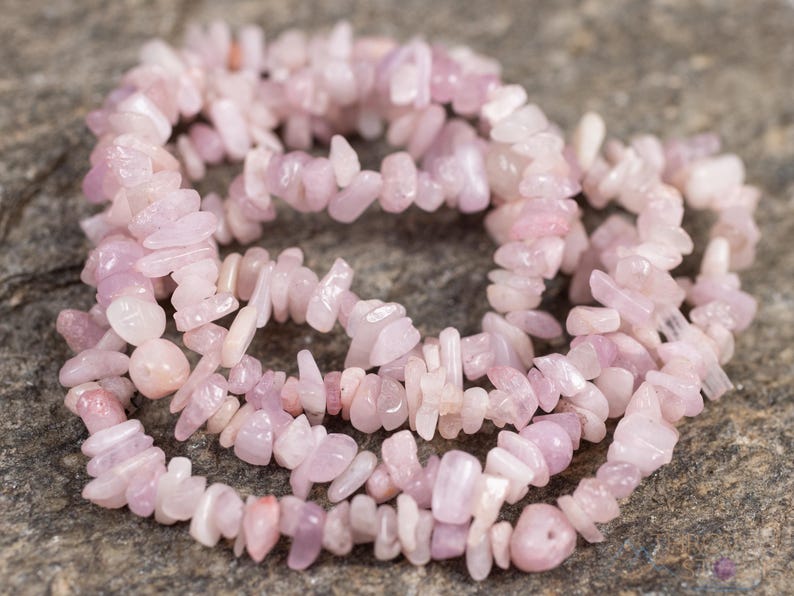 These pale pink Kunzite crystal necklaces have crystal chip beads strung on beading cord for an endless necklace. 
Crystals are nature-made therefore each one is unique in appearance.