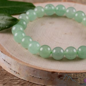 These pastel green Aventurine crystal bracelets have sphere beads strung on elastic for an endless bracelet. 
Crystals are nature-made therefore each one is unique in appearance.