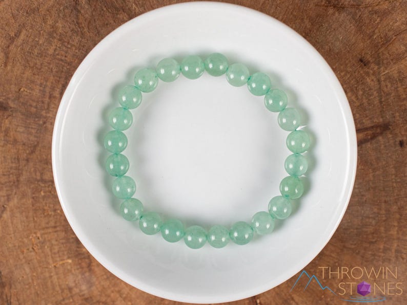 These pastel green Aventurine crystal bracelets have sphere beads strung on elastic for an endless bracelet. 
Crystals are nature-made therefore each one is unique in appearance.