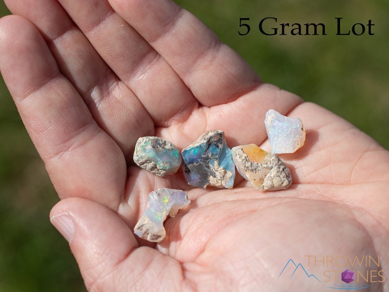 These raw Opal crystals are chunk shaped and rainbow colored with patches of tan matrix.
Crystals are nature-made therefore each one is unique in appearance.