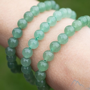 These pastel green Aventurine crystal bracelets have sphere beads strung on elastic for an endless bracelet. 
Crystals are nature-made therefore each one is unique in appearance.