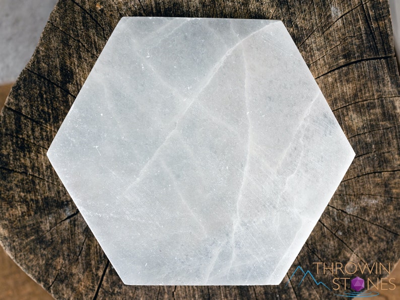 These are white Selenite crystal carved polished hexagon plates.
Crystals are nature-made therefore each one is unique in appearance.