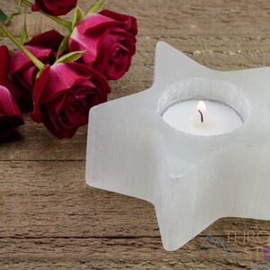 These are white Selenite crystal carved candle holders in the shape of a star.
Crystals are nature-made therefore each one is unique in appearance.