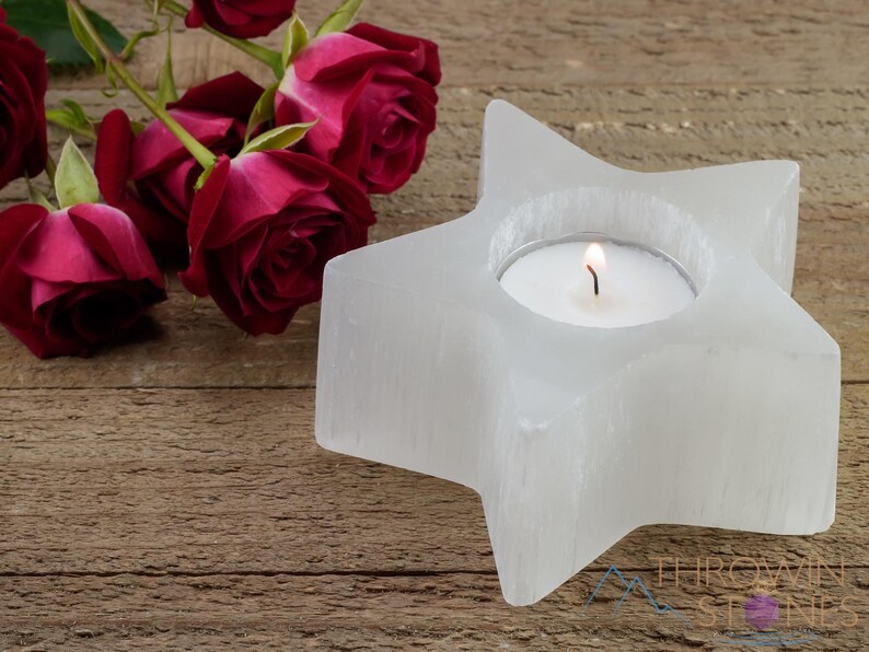 These are white Selenite crystal carved candle holders in the shape of a star.
Crystals are nature-made therefore each one is unique in appearance.