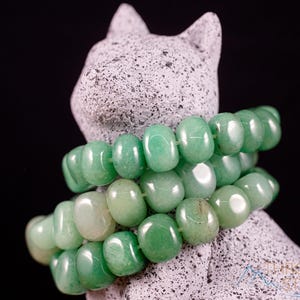 These pale Green Aventurine crystal bracelets have tumbled beads strung on elastic for an endless bracelet.  
Crystals are nature-made therefore each one is unique in appearance.