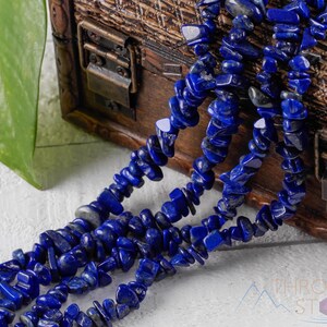 Handcrafted Lapis Lazuli chip necklace. These genuine, natural, tumbled chips, are drilled, and strung on elastic cord to create an endless necklace. This gemstone necklace is blue, weighs around 80 grams, and is approximately 34 inches in length.