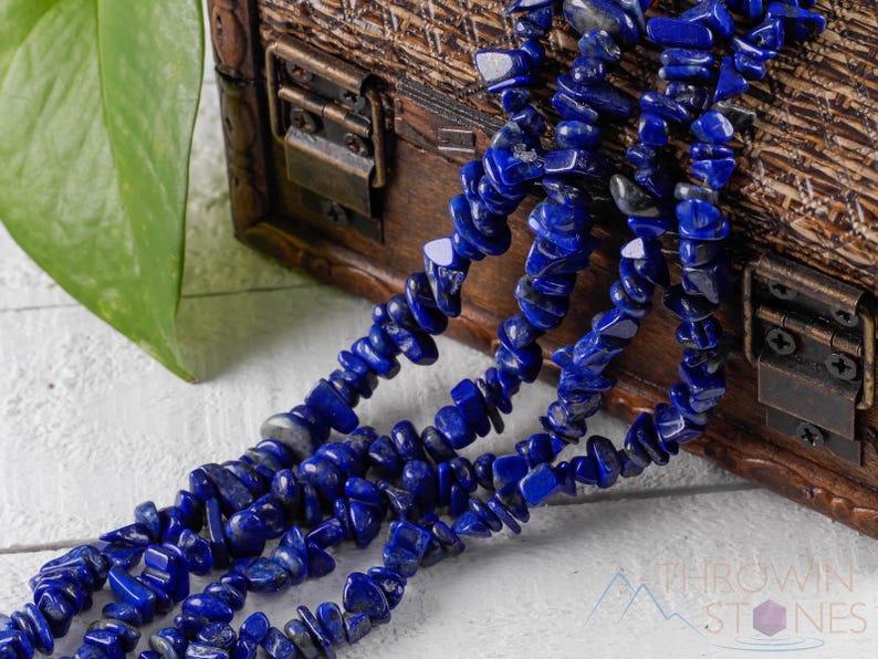 Handcrafted Lapis Lazuli chip necklace. These genuine, natural, tumbled chips, are drilled, and strung on elastic cord to create an endless necklace. This gemstone necklace is blue, weighs around 80 grams, and is approximately 34 inches in length.