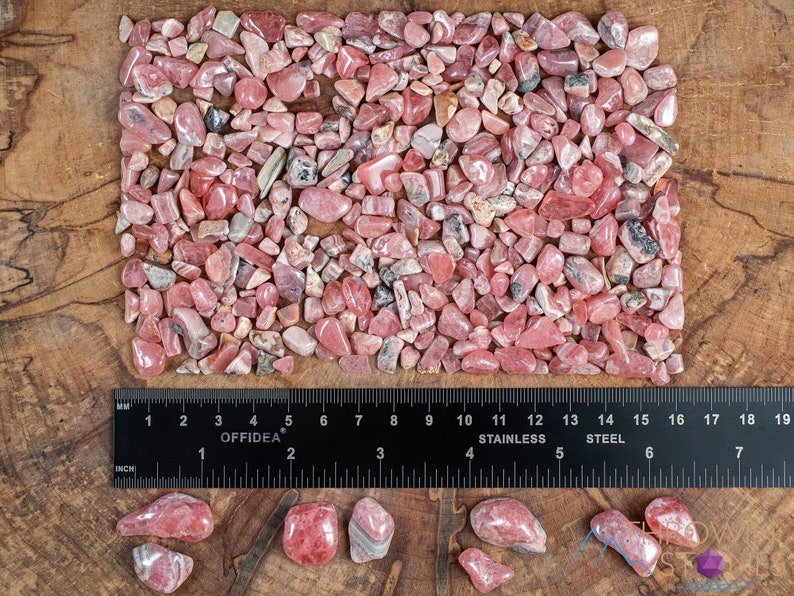 Rhodochrosite Crystal Chips. These stones are light pink to bright pink and often include a white banding. They are great for jewelry making and crystal decor. Each specimen is unique and varies in color, shape, and pattern. Listing has variations.