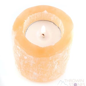 These peachy orange Selenite crystal carved raw cylindrical votive candle holders range in a variety of sizes.  
Crystals are nature-made therefore each one is unique in appearance.