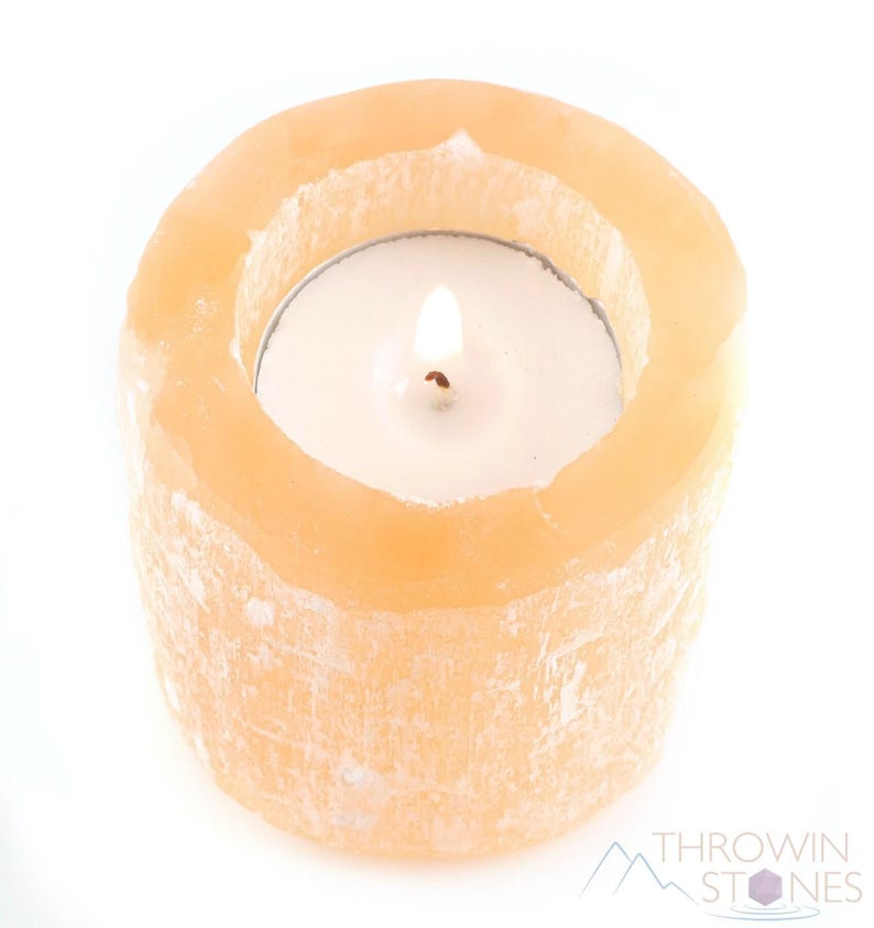 These peachy orange Selenite crystal carved raw cylindrical votive candle holders range in a variety of sizes.  
Crystals are nature-made therefore each one is unique in appearance.