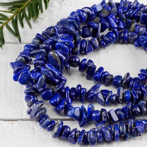Handcrafted Lapis Lazuli chip necklace. These genuine, natural, tumbled chips, are drilled, and strung on elastic cord to create an endless necklace. This gemstone necklace is blue, weighs around 80 grams, and is approximately 34 inches in length.